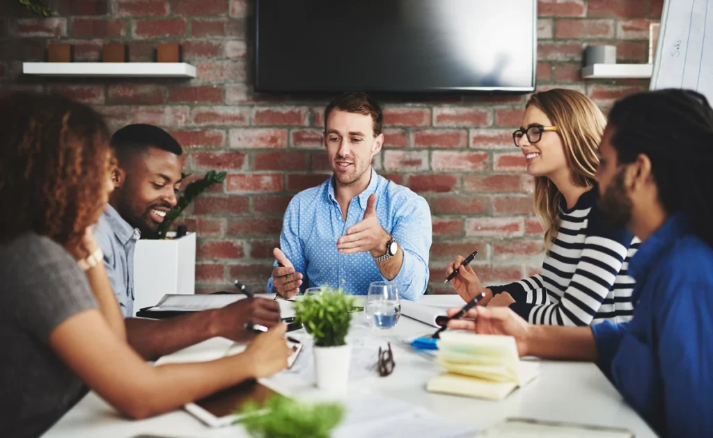 Business team gathered in meeting room for collaboration session