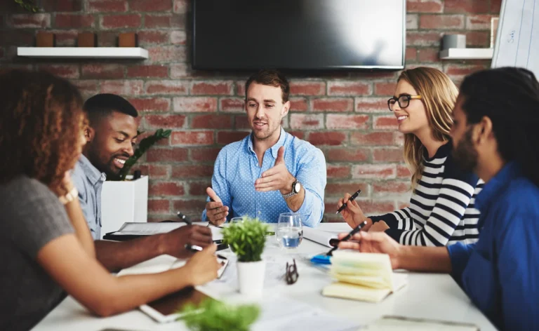 Business team gathered in meeting room for collaboration session